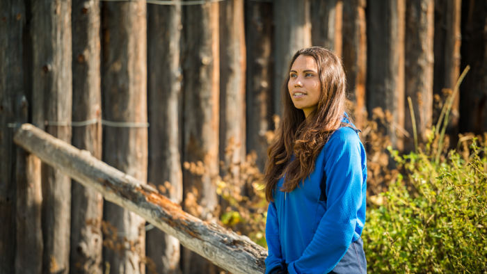 A smiling Indigenous Canadian woman outdoors.