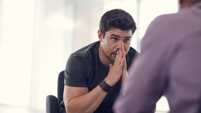 Man in a meeting listening