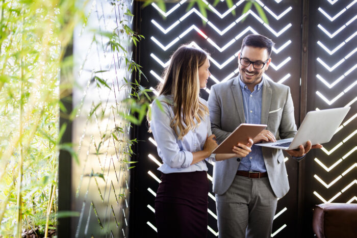 Two colleagues at meeting in modern office interior