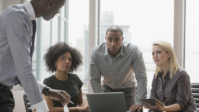 business meeting featuring multiple people