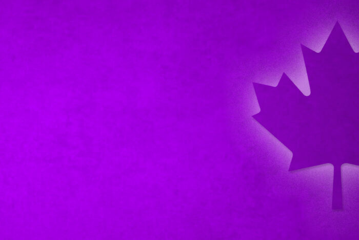 Purple background with decorative illuminated Canadian Maple Leaf