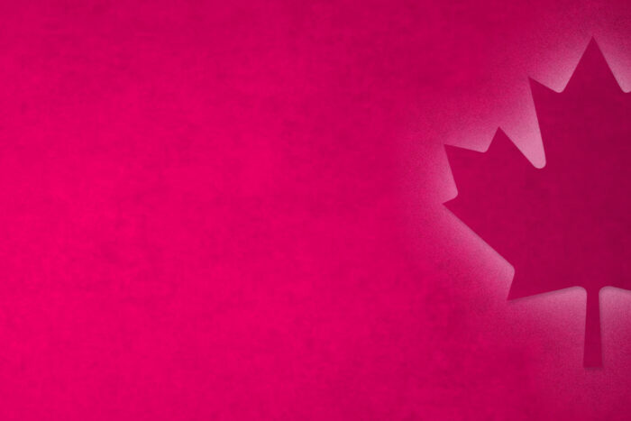 magenta hero image with a illuminated Canadian maple leaf